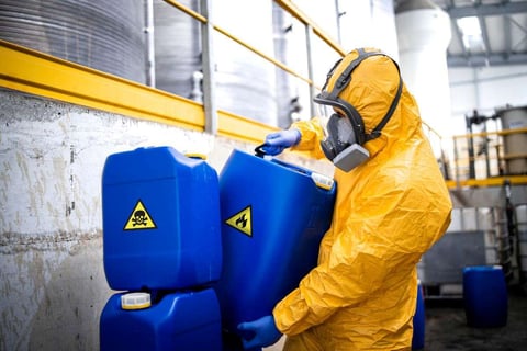 Maintenance worker handling chemicals