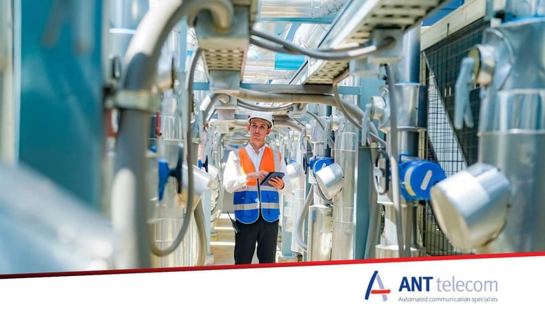 Industrial worker in large plant operating alone