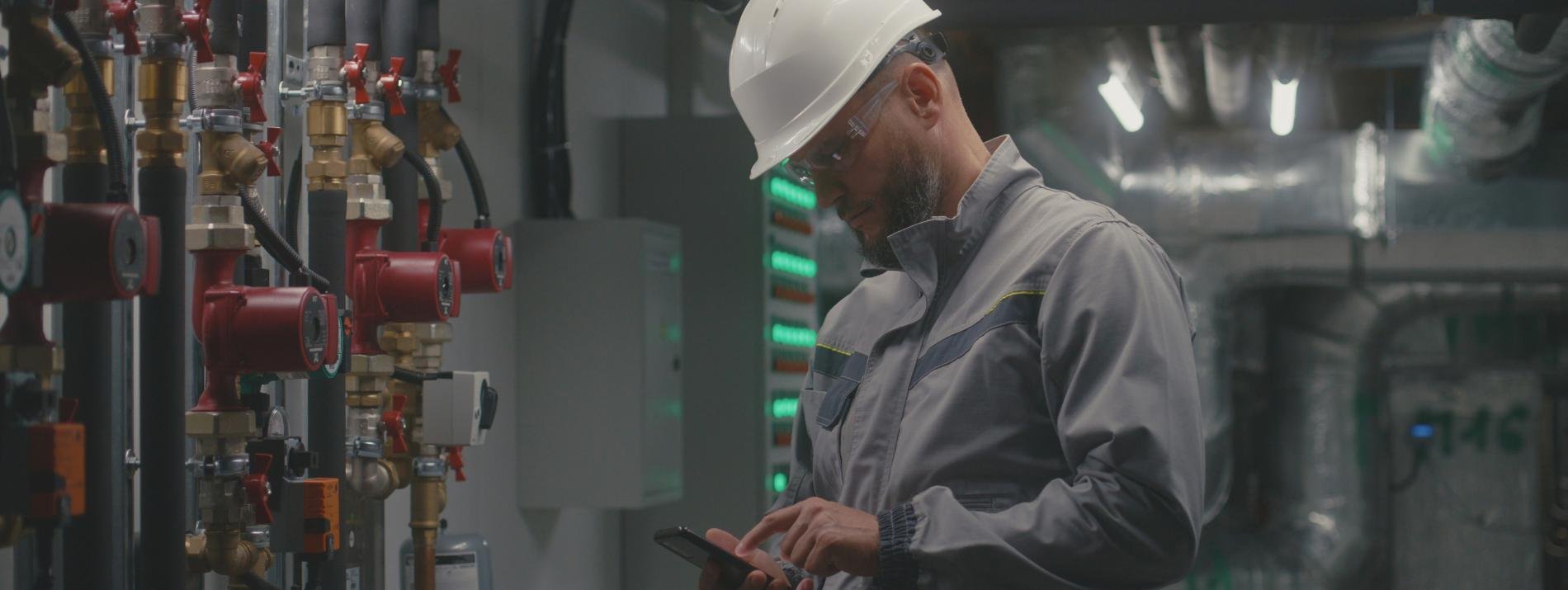 A maintenance engineer and responder receiving a critical alert on this handset