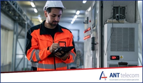 A man monitoring and updating temperature records manually