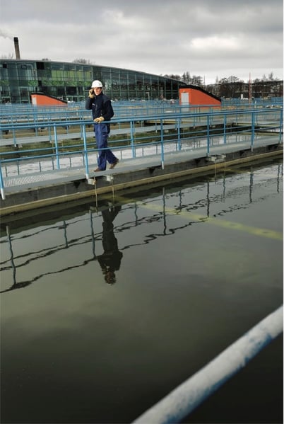 man walking on work site using voice over wifi device 