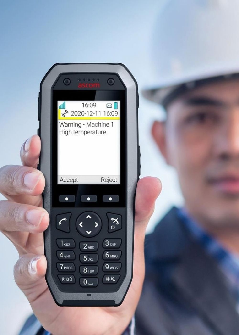 A machine temperature alarm displayed on a DECT handset